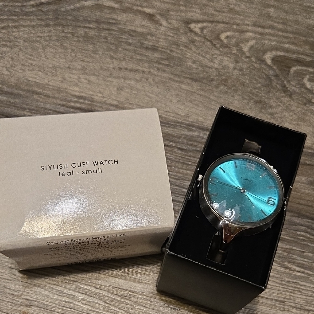 NIB AVON stylish Teal And Silvertone Cuff Watch